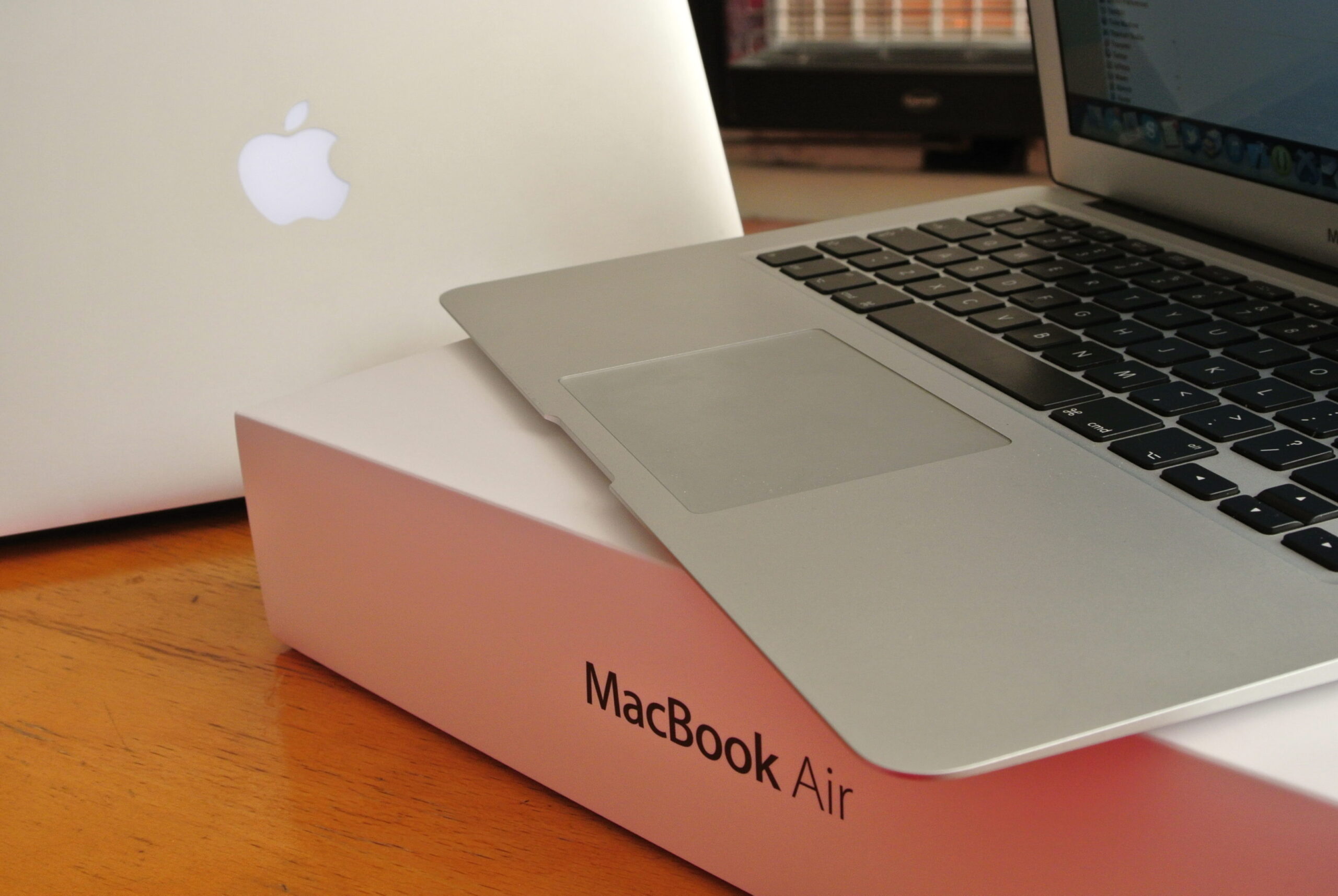 Mid 2012 MacBook Air 13" i7 2.0GHz & 8GB of RAM in front of Helen's MacBook Air