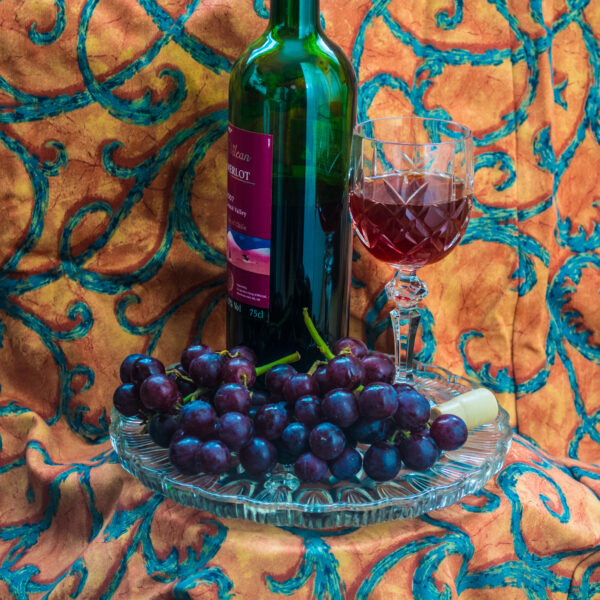 Bottle of Merlot with Glass and Grapes