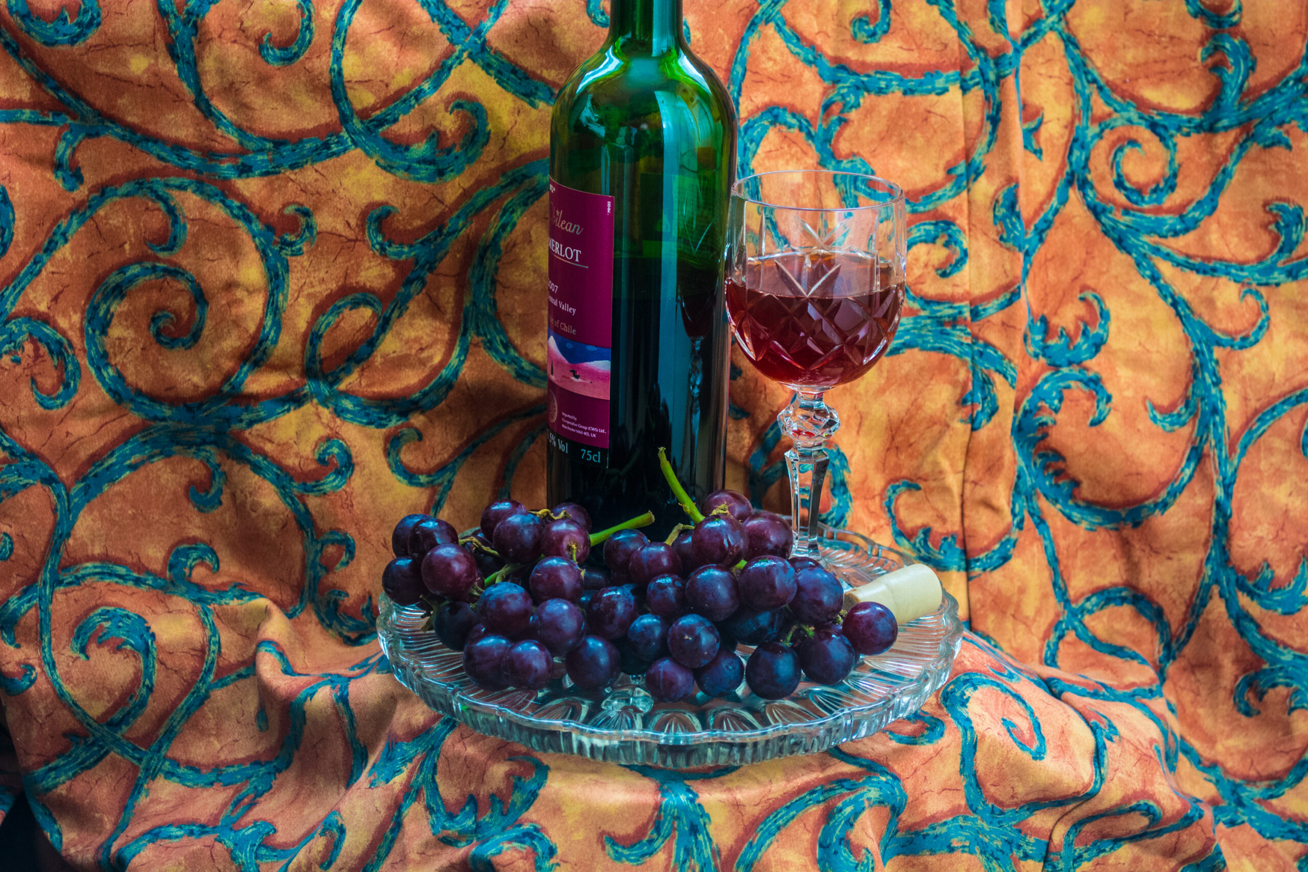 Bottle of Merlot with Glass and Grapes