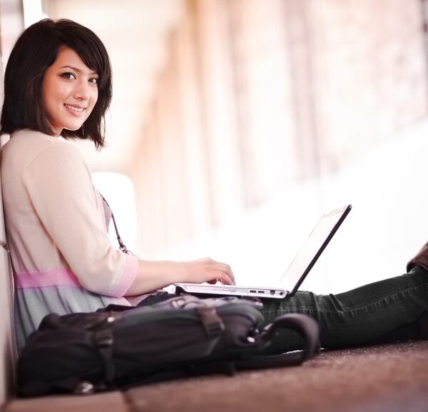 Teenage Girl Sat Using Laptop