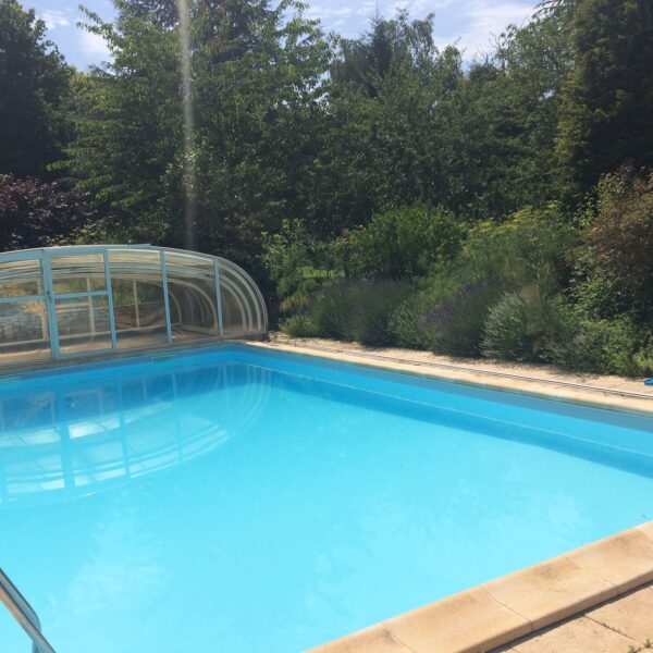 Swimming Pool in France with Sliding Glass Cover with Door