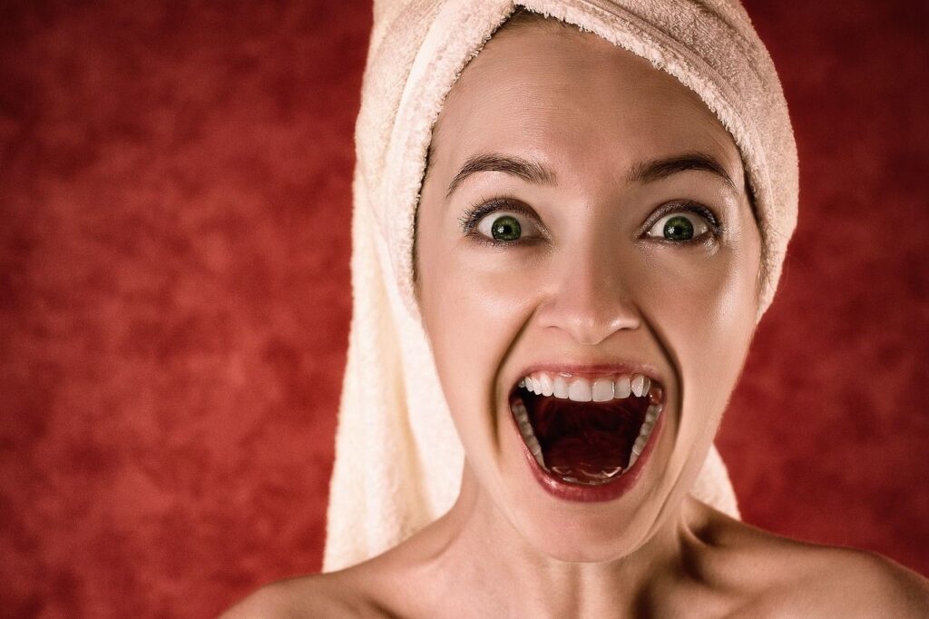 Smiling Woman with Towel Wrapped Around Hair