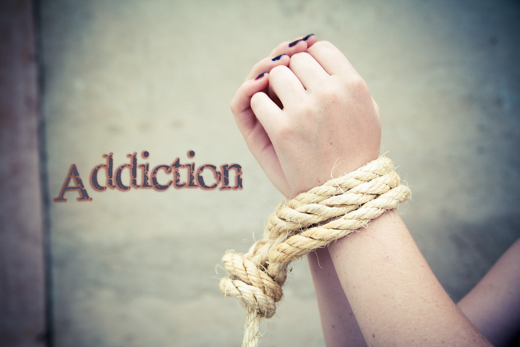 Addiction - bound hands with rope