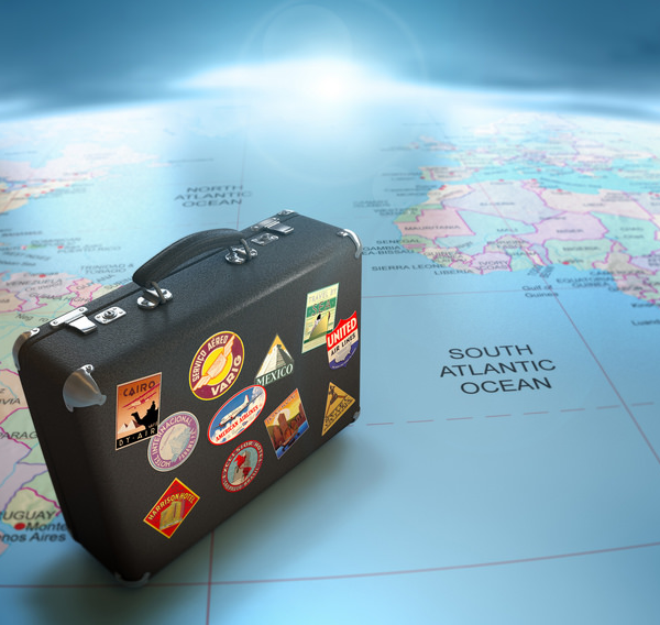 Suitcase on a world map