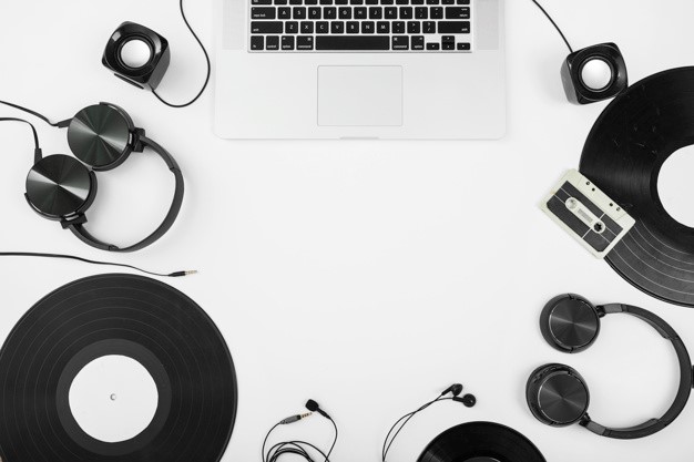 MacBook, speakers, headphones, earphones and vinyl records