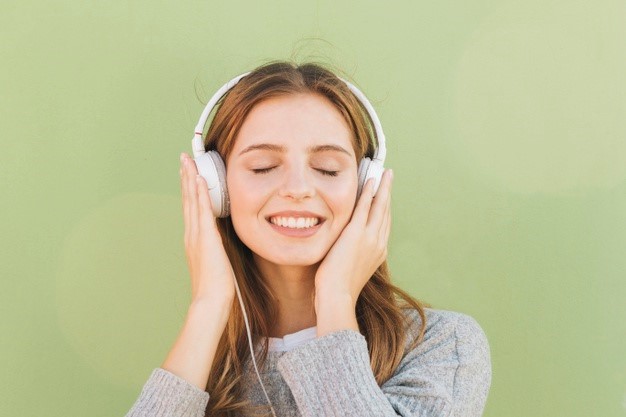 Woman listening to music with headphones