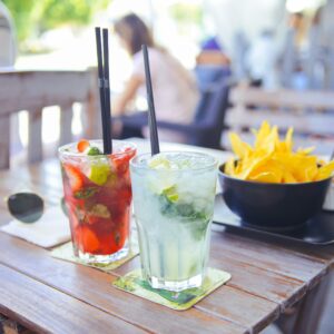 Cocktails and food on an outdoor table