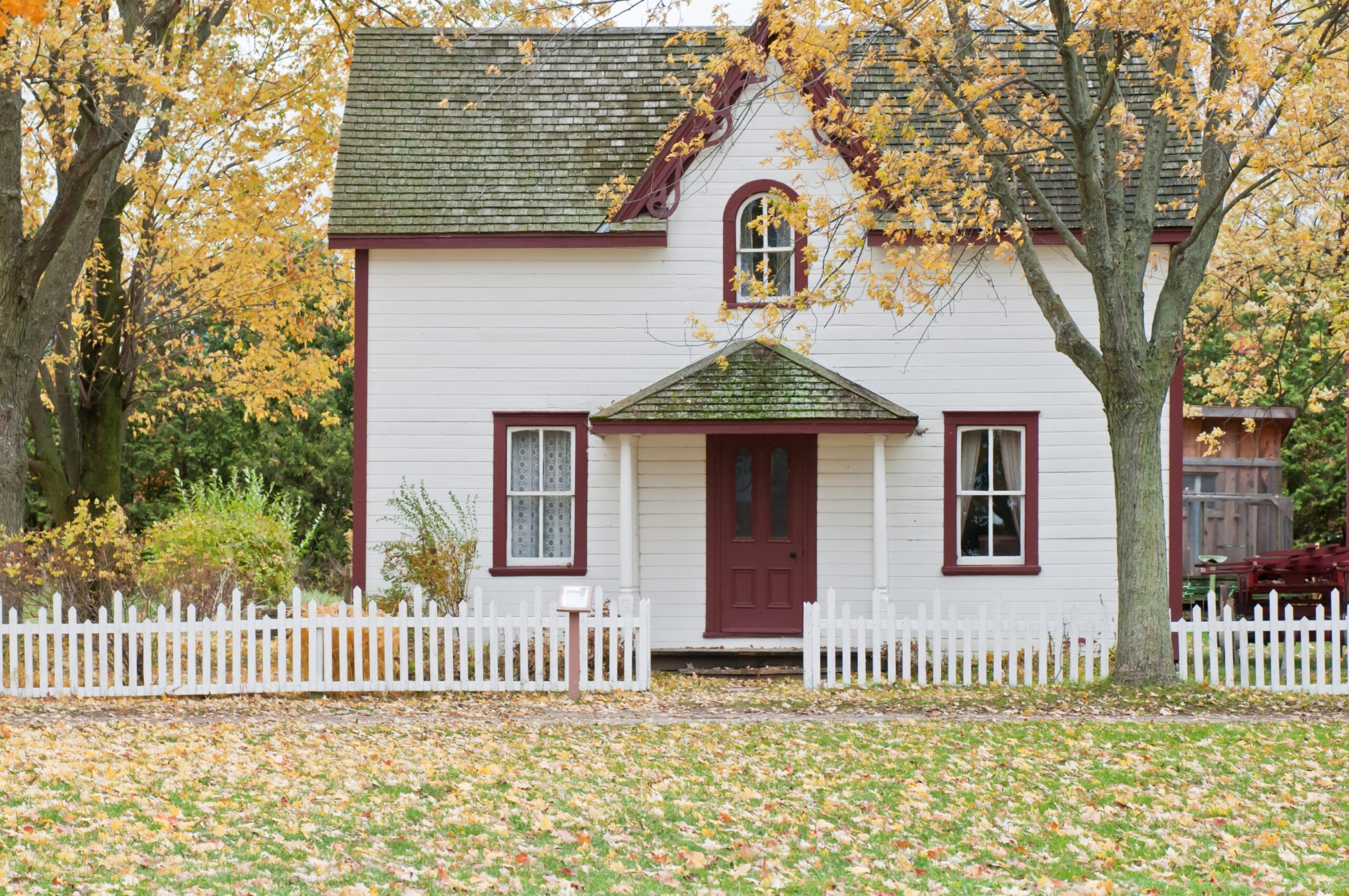 Cute house with white fence