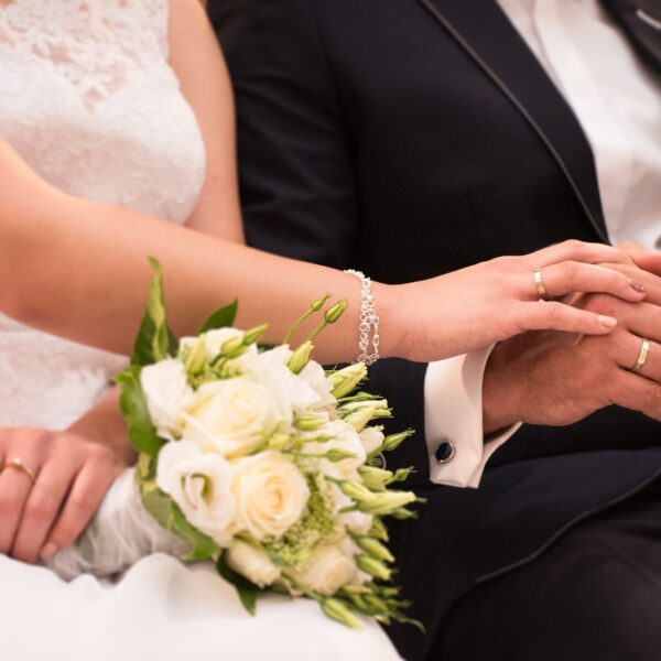 Bride holding groom's hand