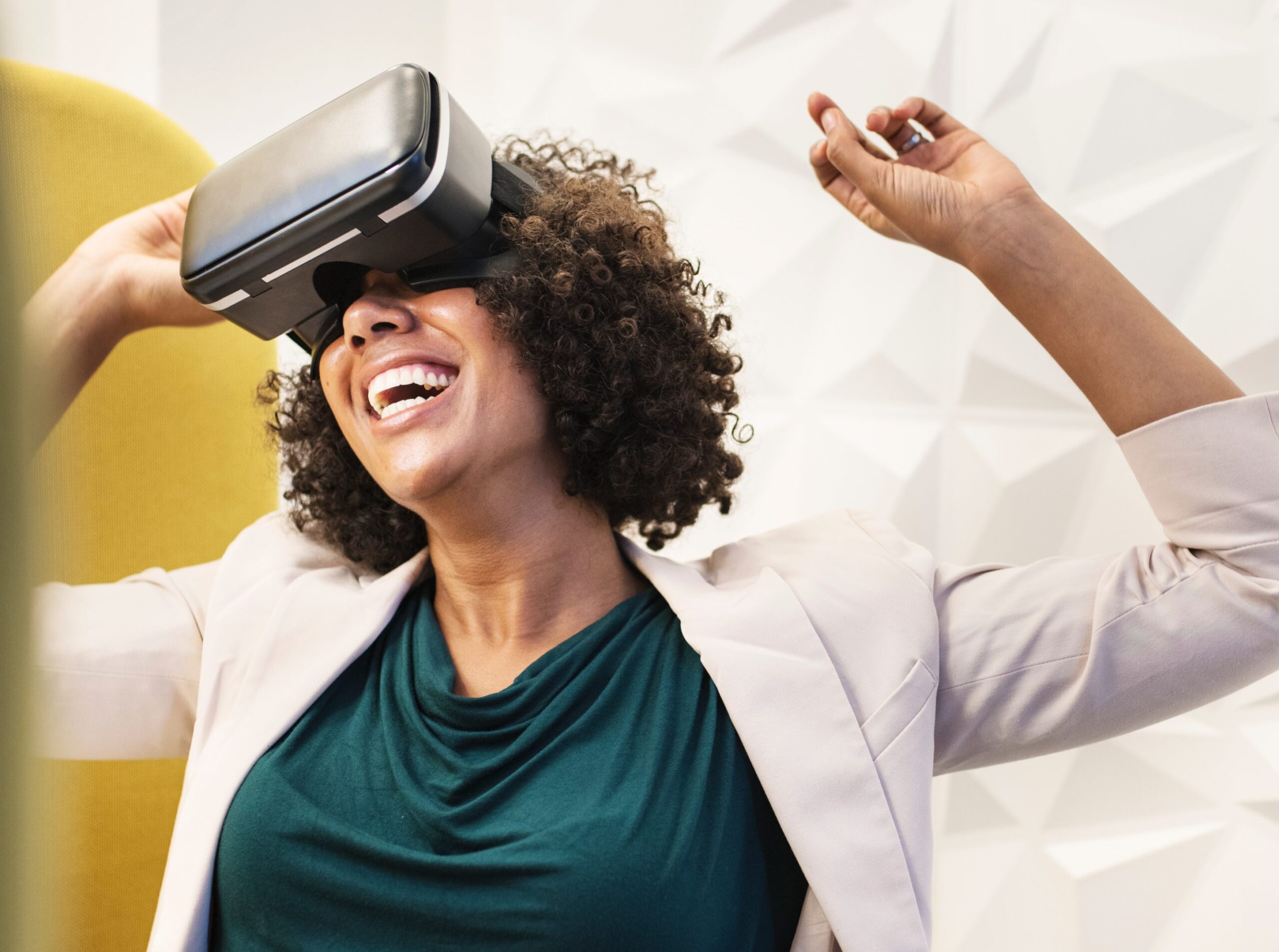Woman smiling using virtual reality goggles