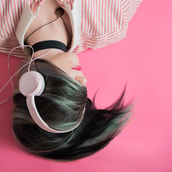 Woman listening to music on headphones