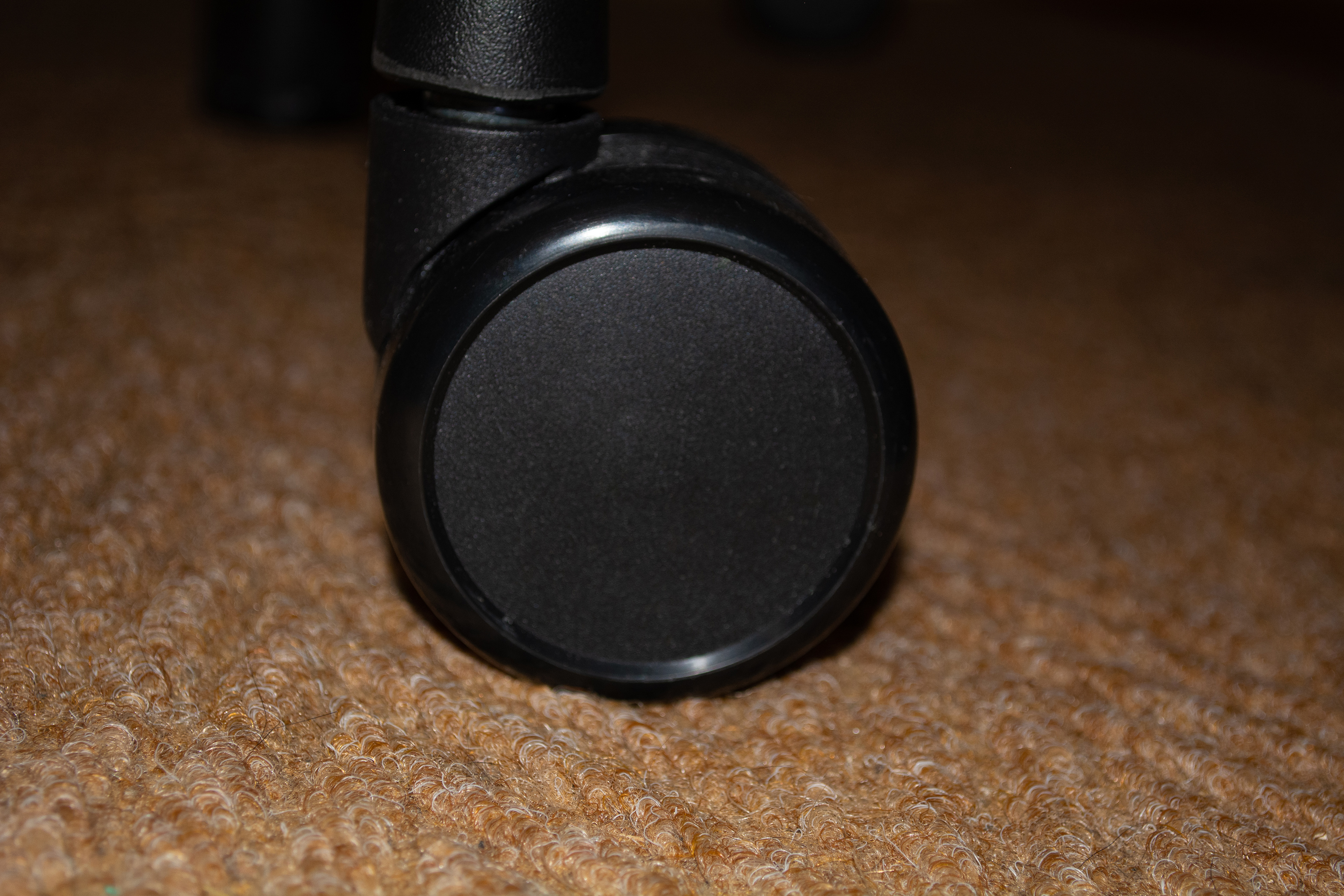 Closeup of a wheel on the EDGE GX1 gaming chair