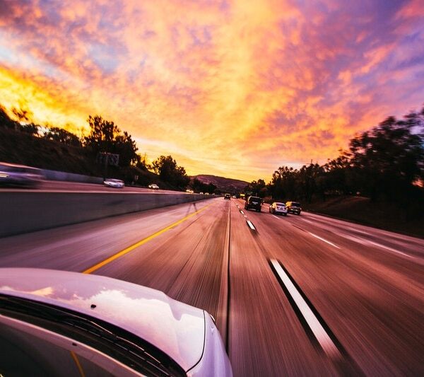 HDR photograph of car driving on highway