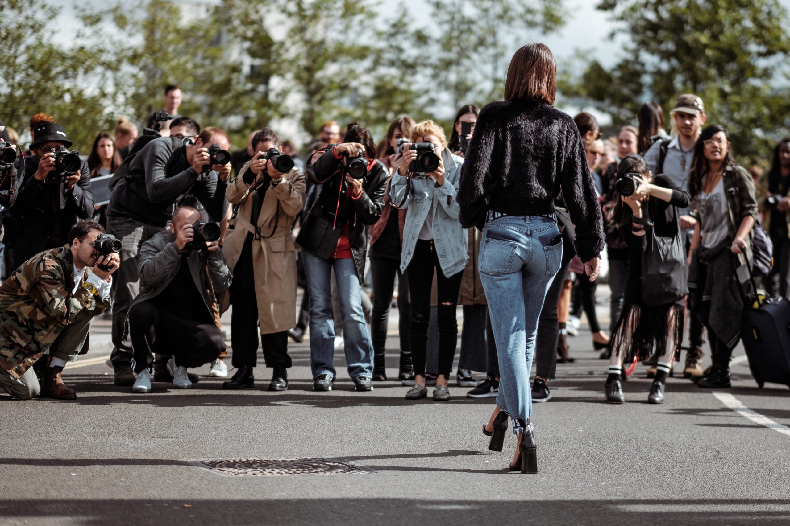 Paparazzi takes photographs of model at London Fashion Week 2017