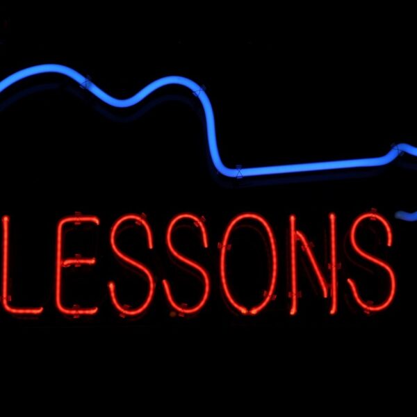 Guitar Lessons Neon Sign