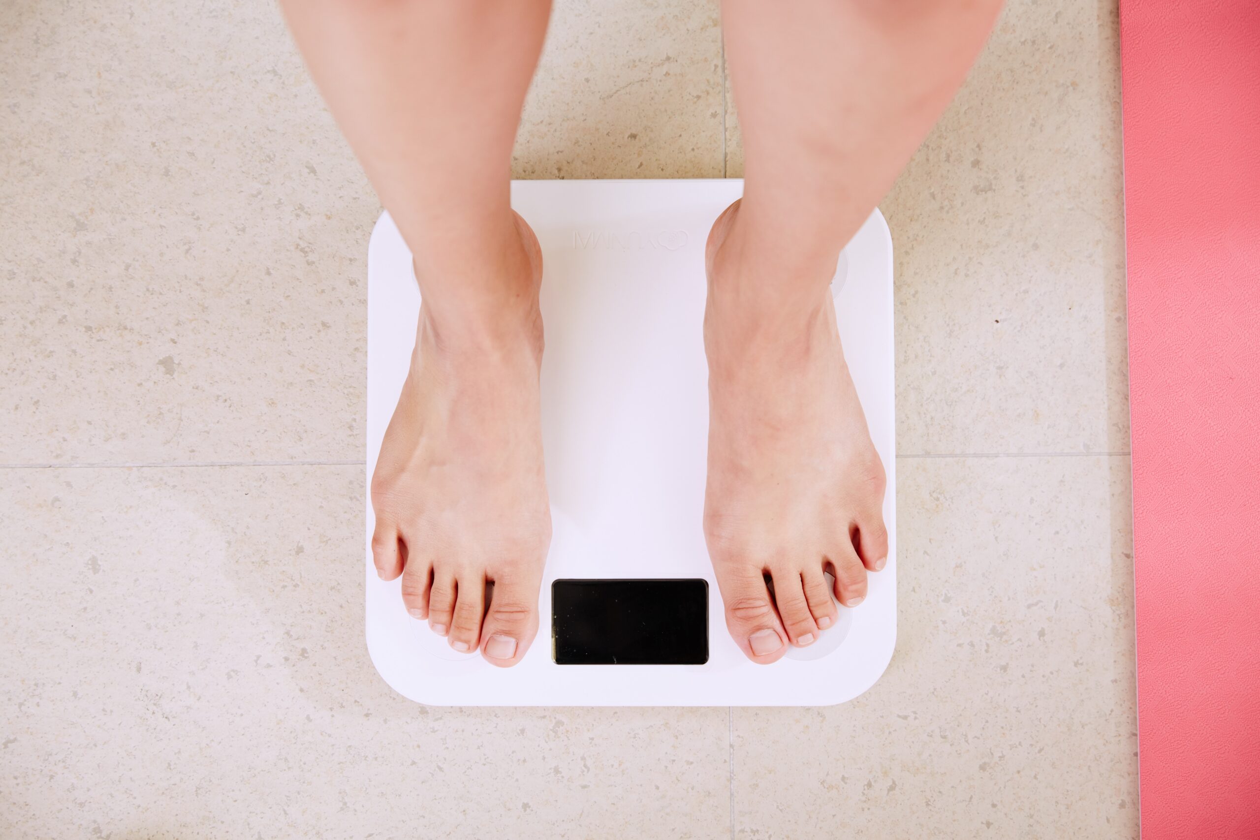 Person standing on digital bathroom scales