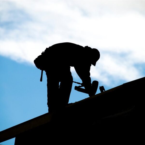 Roofing contractor working on a roof