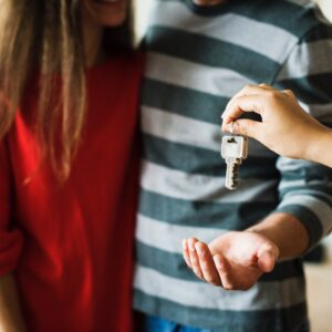 Couple accepting key to property