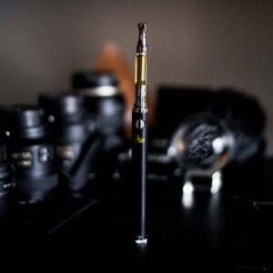 Shallow focus photograph of vape pen on desk