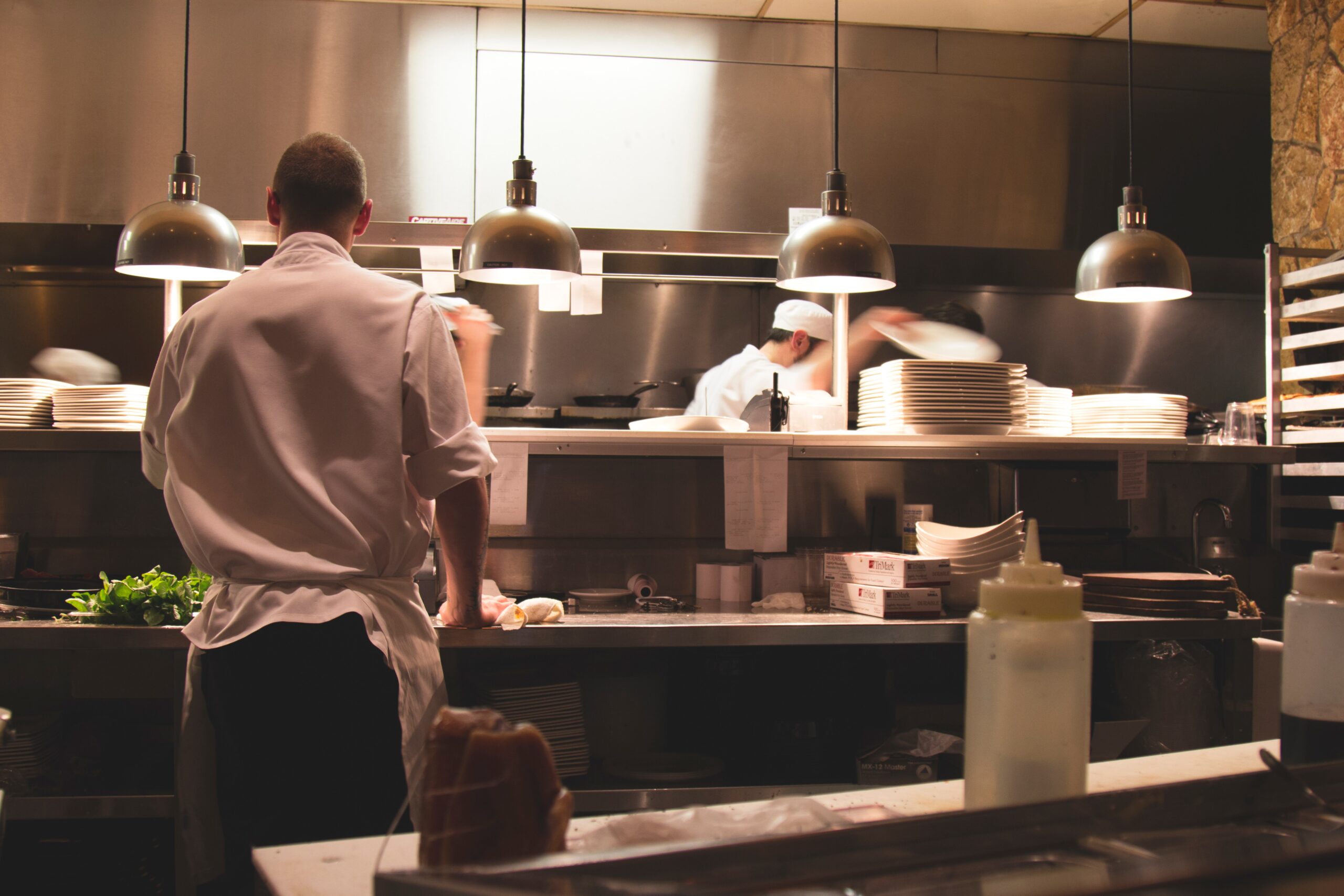 Chefs cooking in an industrial kitchen