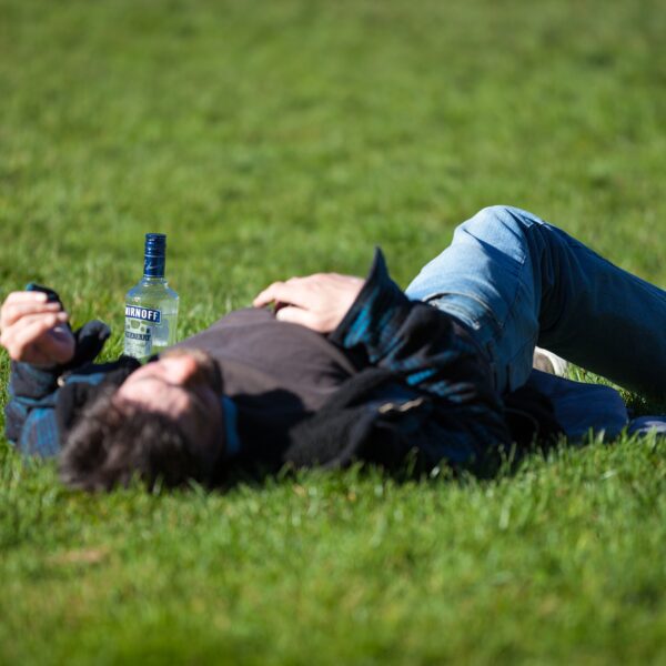 Person drinking in park