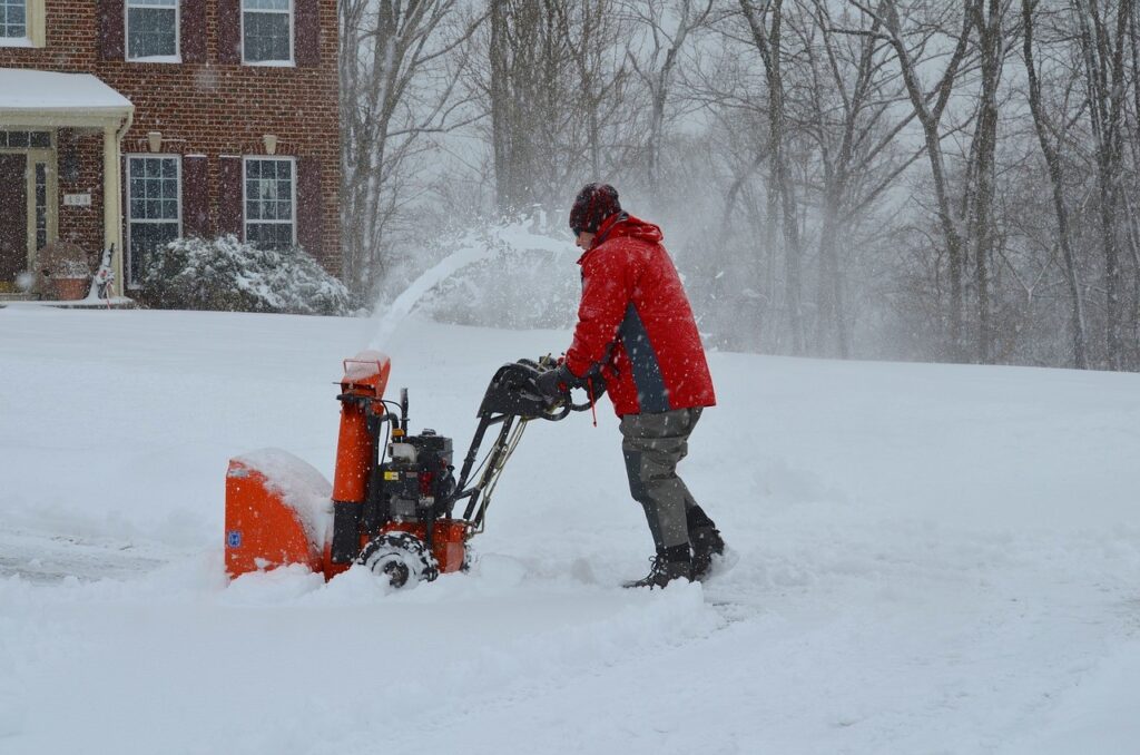 Man using a snow blower