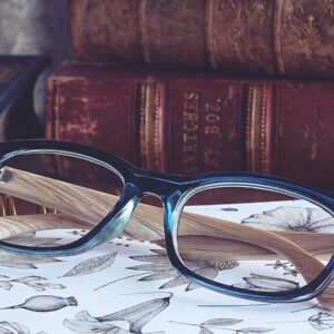 Glasses next to books