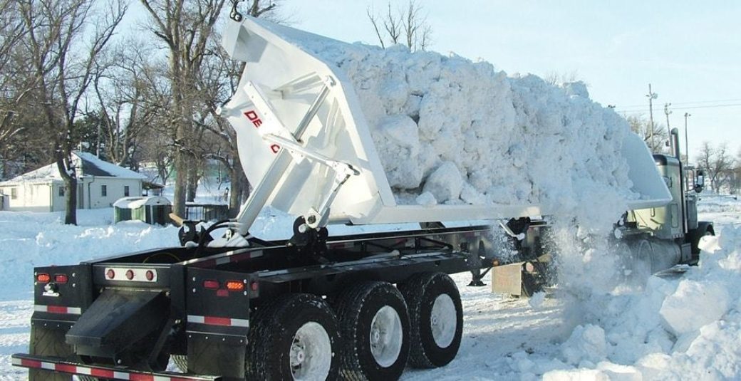 Side dump trailer with snow