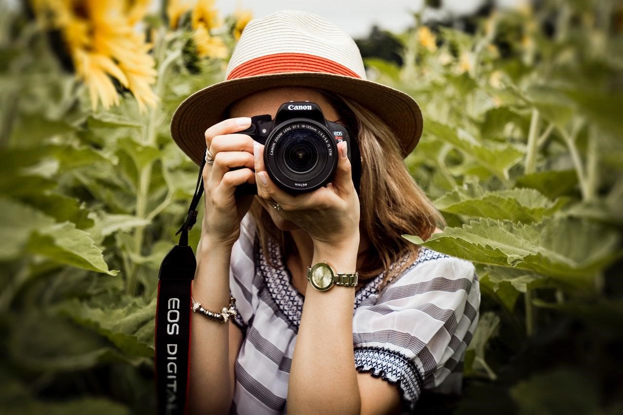 Woman using a Canon DSLR