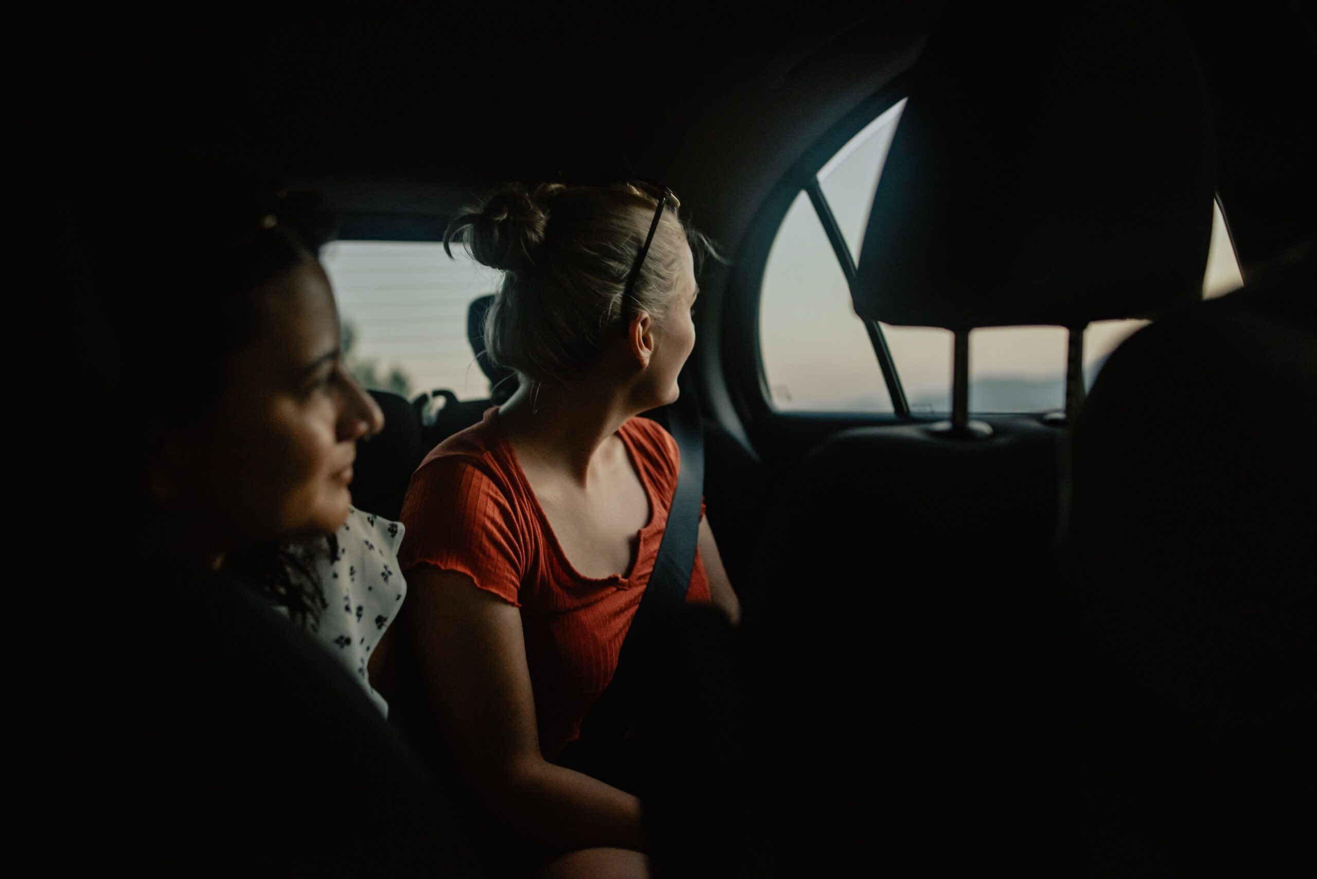 Women looking out of a car window in Cap de Formentor, Spain