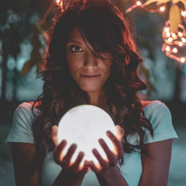 Woman holding a glowing sphere