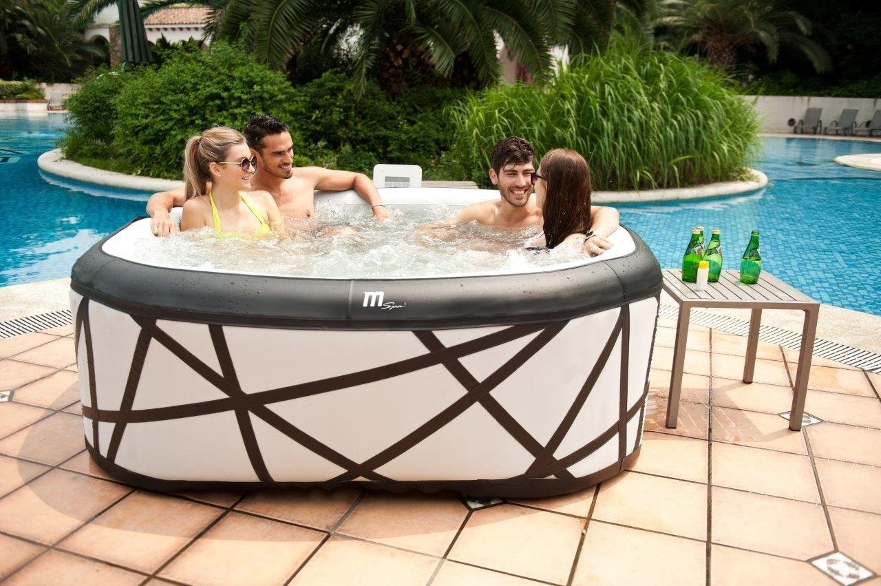 4 people sitting in a hot tub
