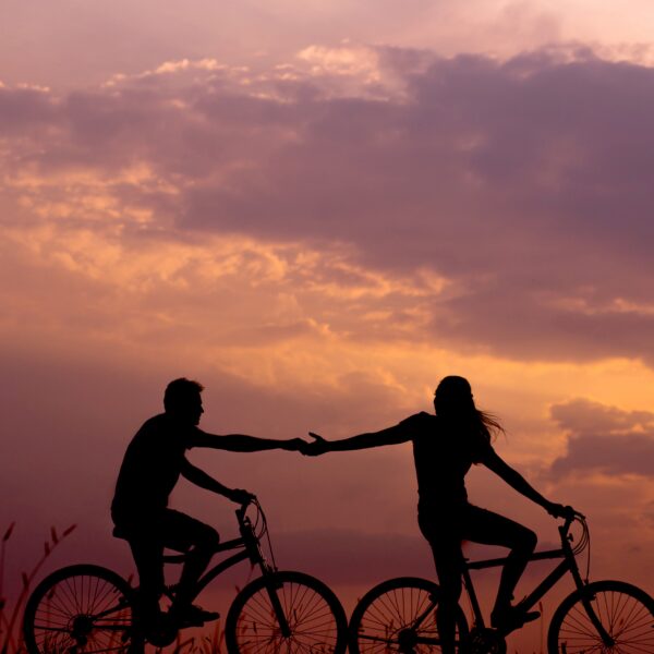 Couple riding bikes together