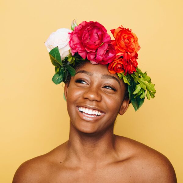 Woman smiling wearing flowers