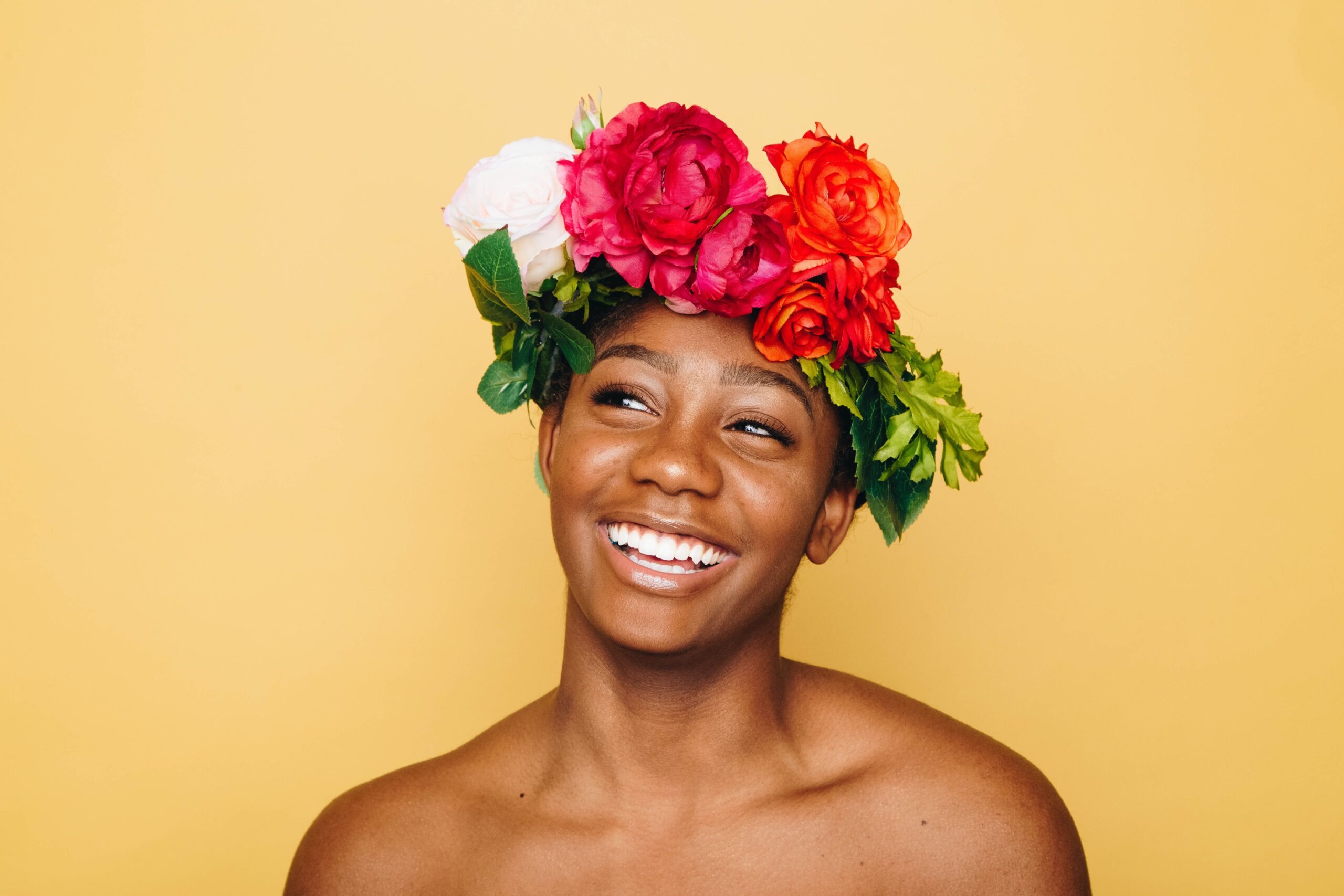 Woman smiling wearing flowers