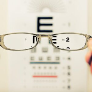 Glasses in front of an eye chart