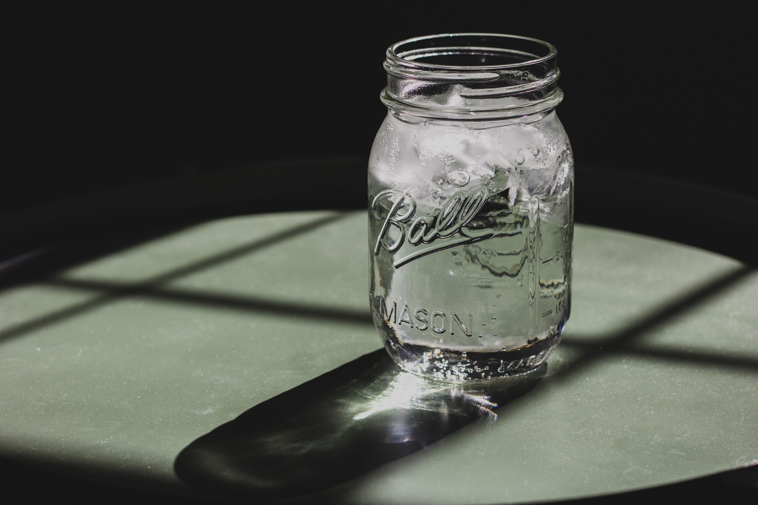 Mason jar with water and ice in it