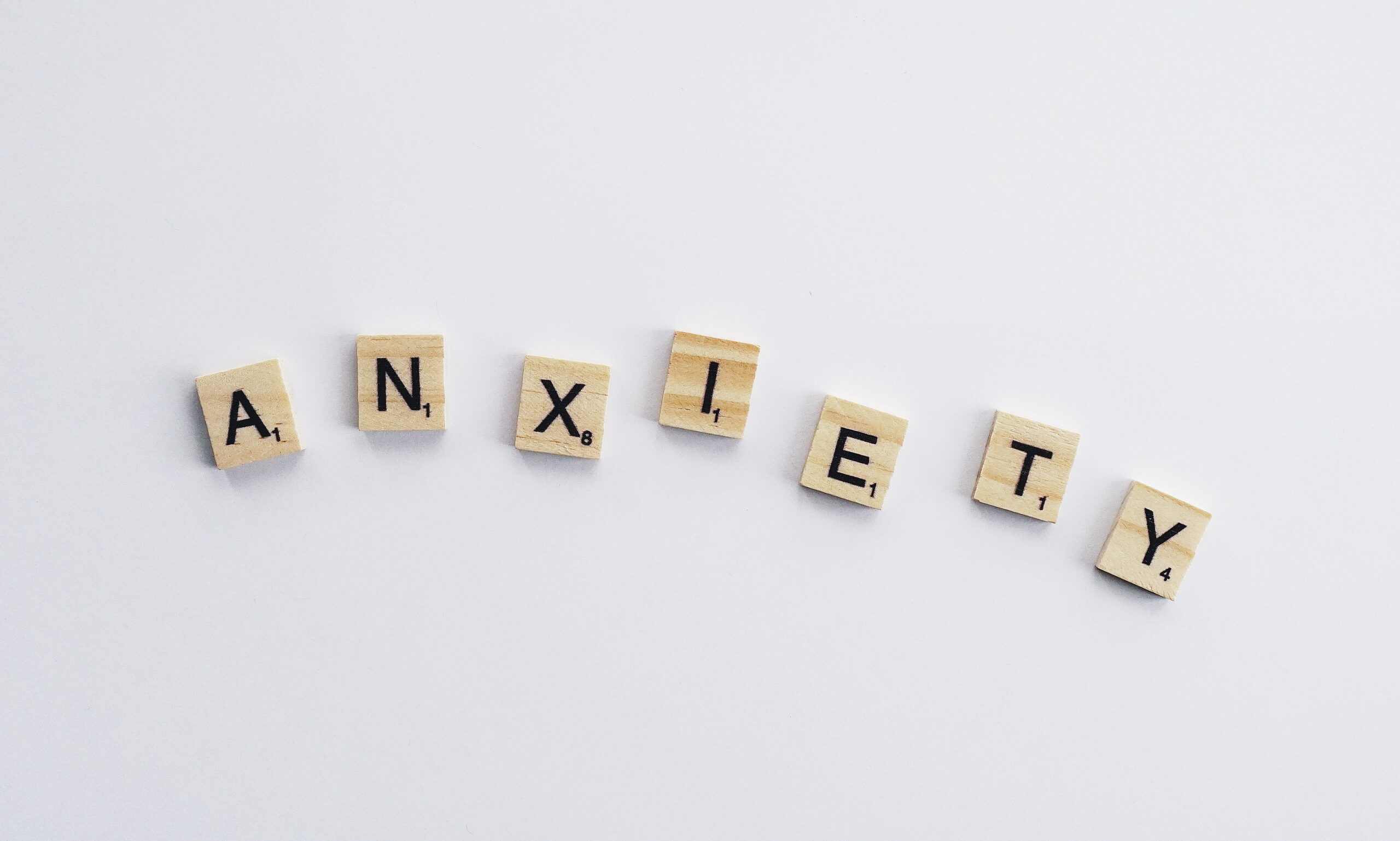 Scrabble pieces that spell out 'anxiety'