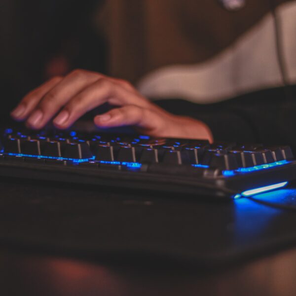 Person typing on keyboard