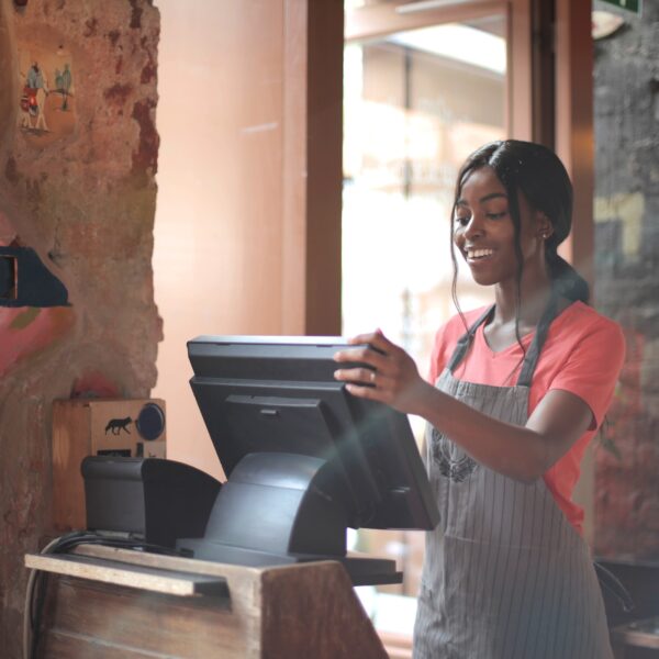 Female cashier using computer