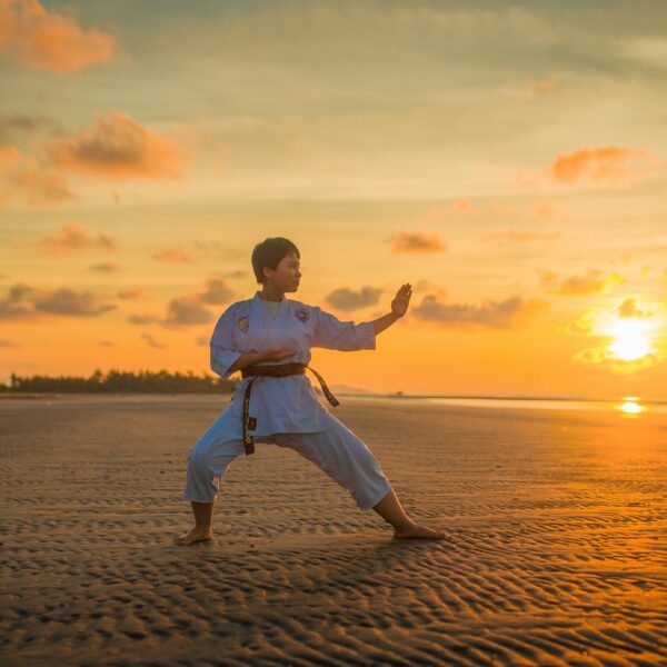 Boy doing karate during the golden hour