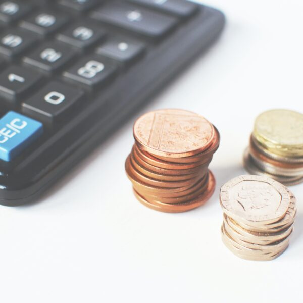 Coins next to a calculator