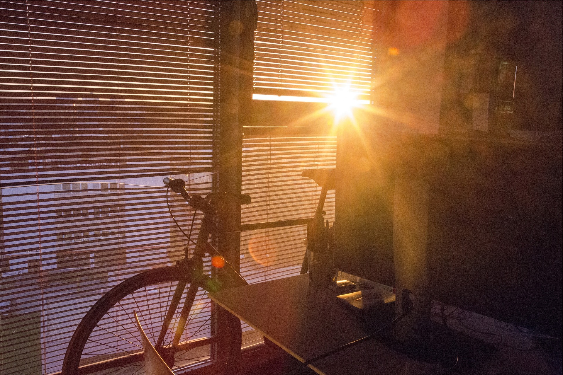 Bicycle in front of blinds