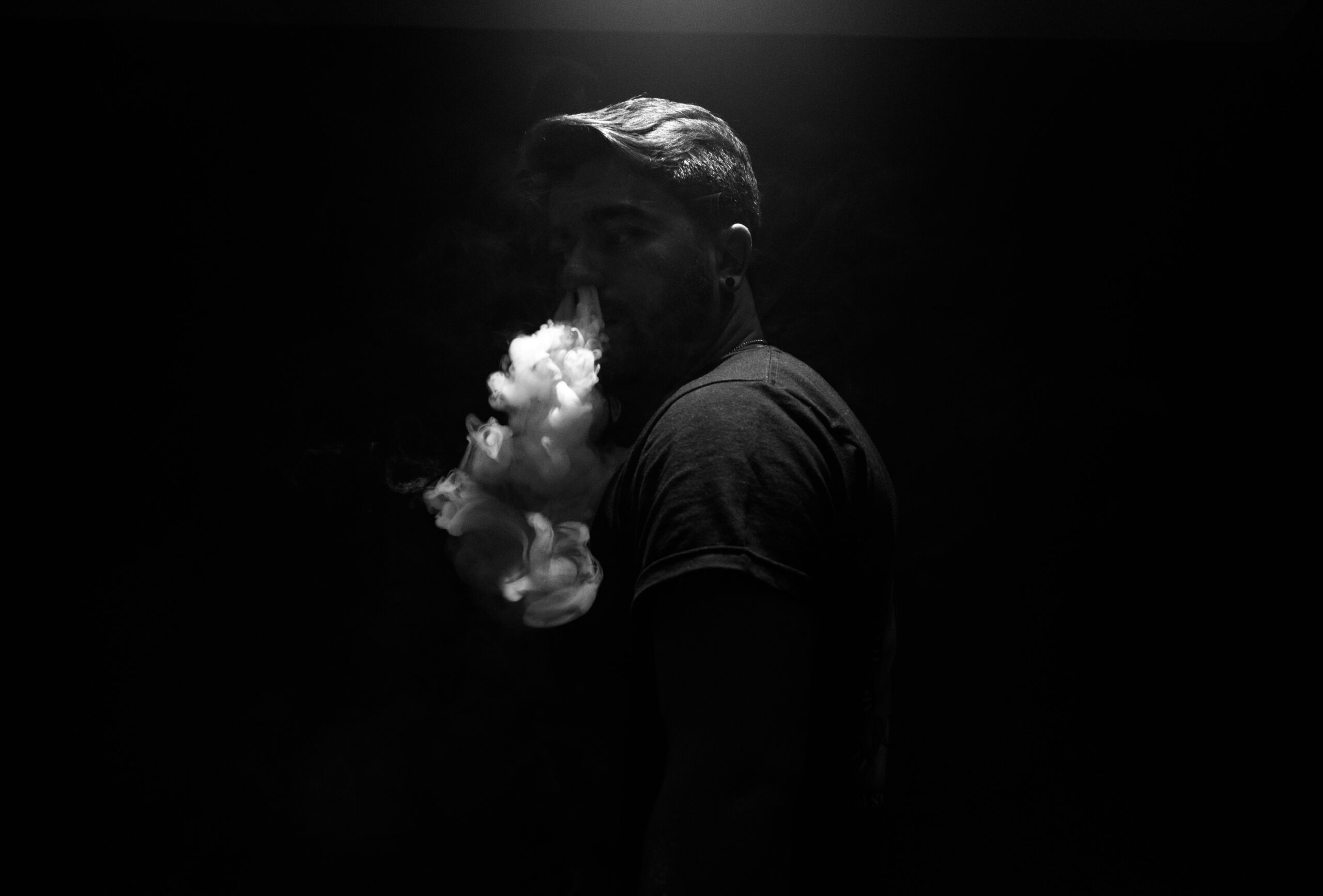 Man exhaling smoke