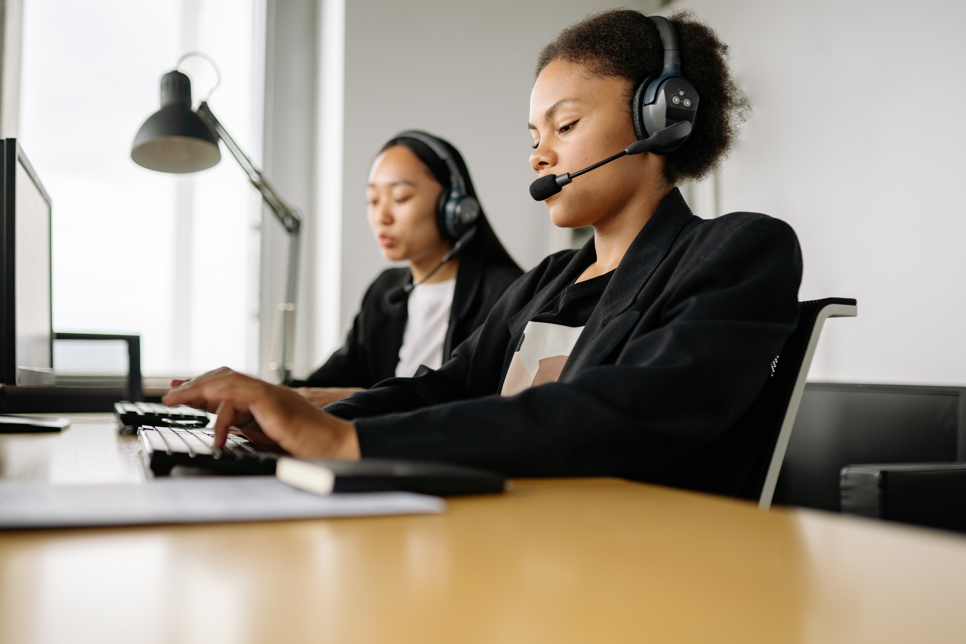 Two women working in a call centre