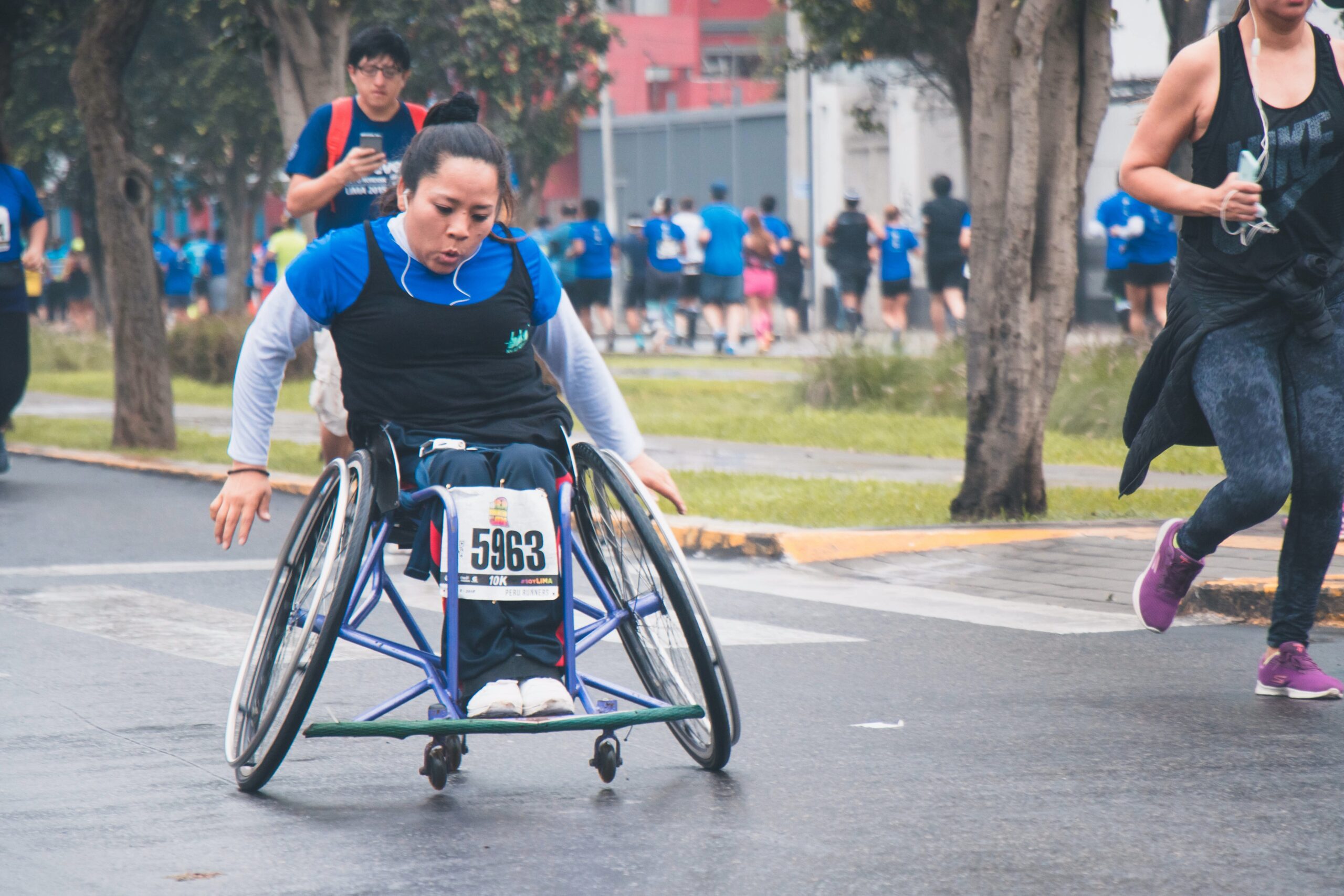 Woman in a wheelchair during a marathon
