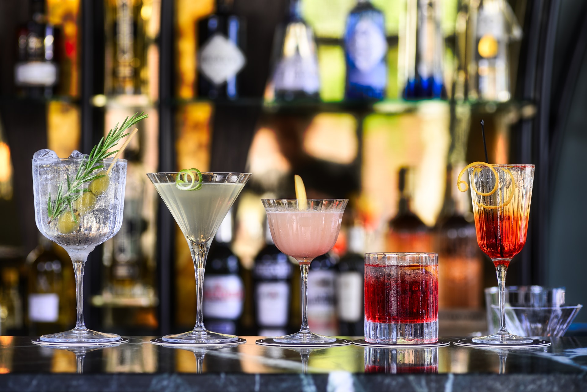 Glasses of cocktails on a bar