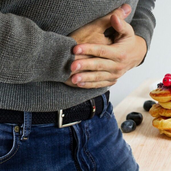 Person clutching their stomach
