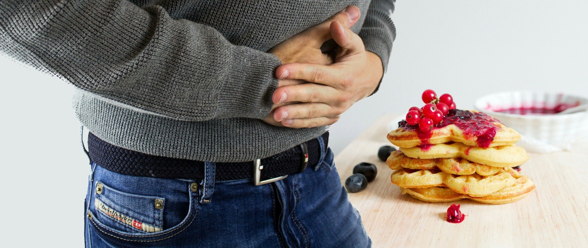 Person clutching their stomach
