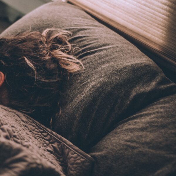 Woman sleeping under blankets